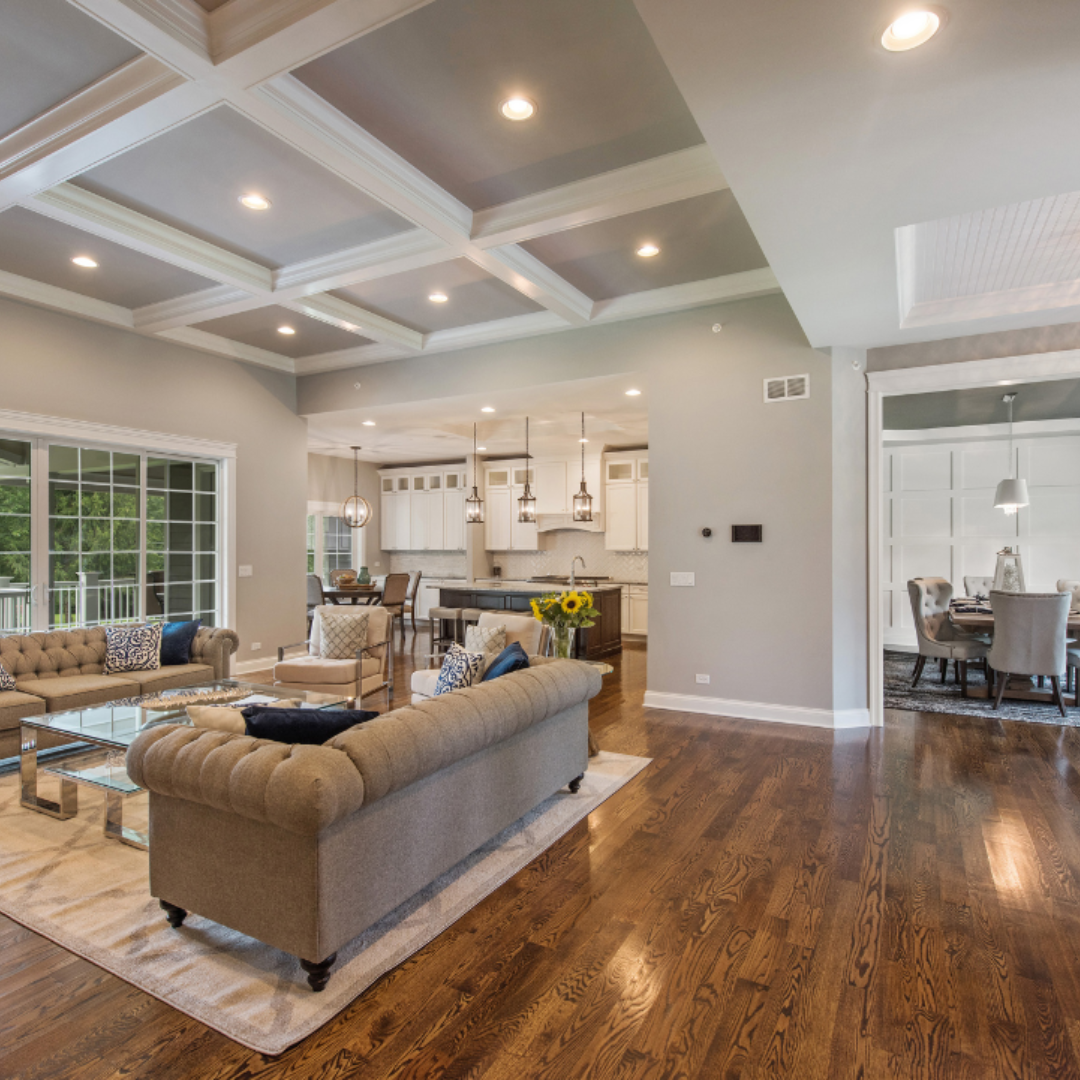 Living room and kitchen with a coffered ceiling and hardwood floors